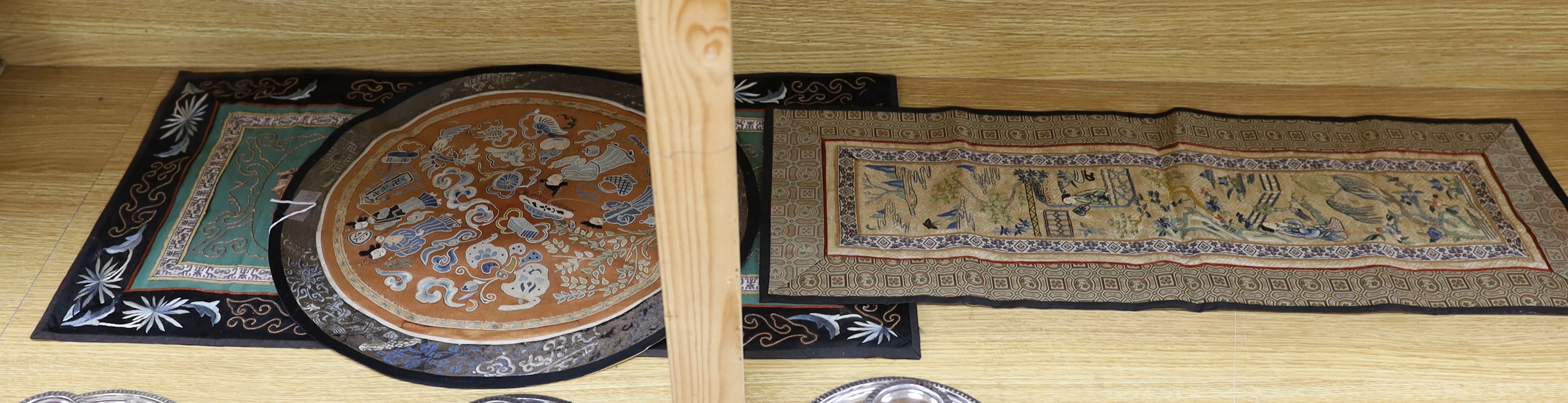 Three Chinese embroidered panels, one embroidered with Chinese knot